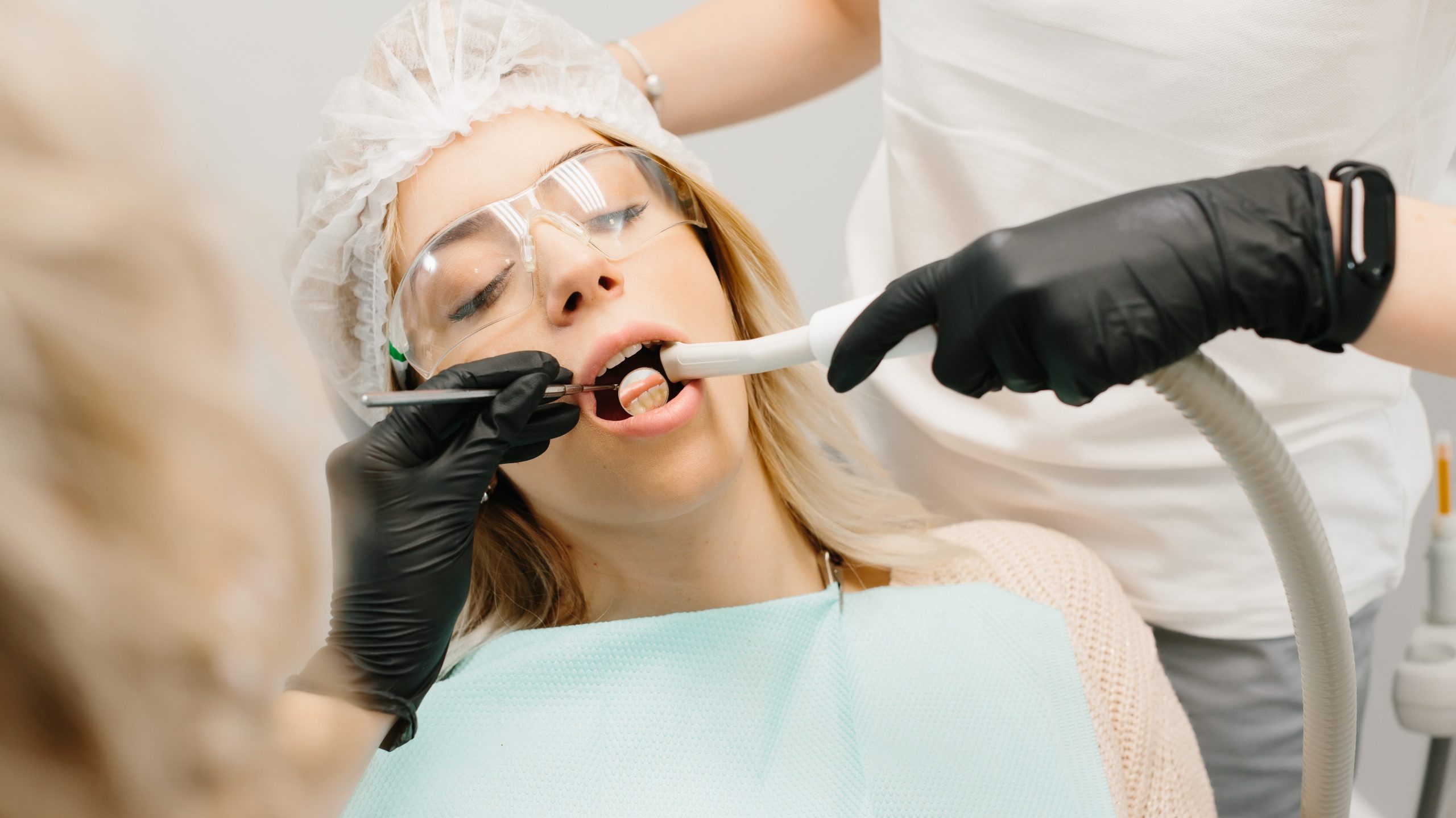 Doctor Dentist with an assistant work in a dental clinic.